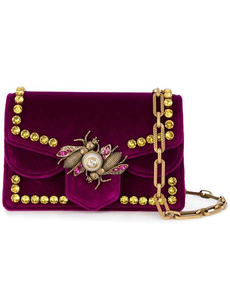 purple gucci bee bag.